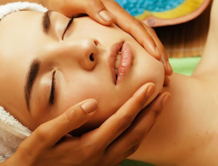 Manual facial massage to improve skin tone and smooth wrinkles